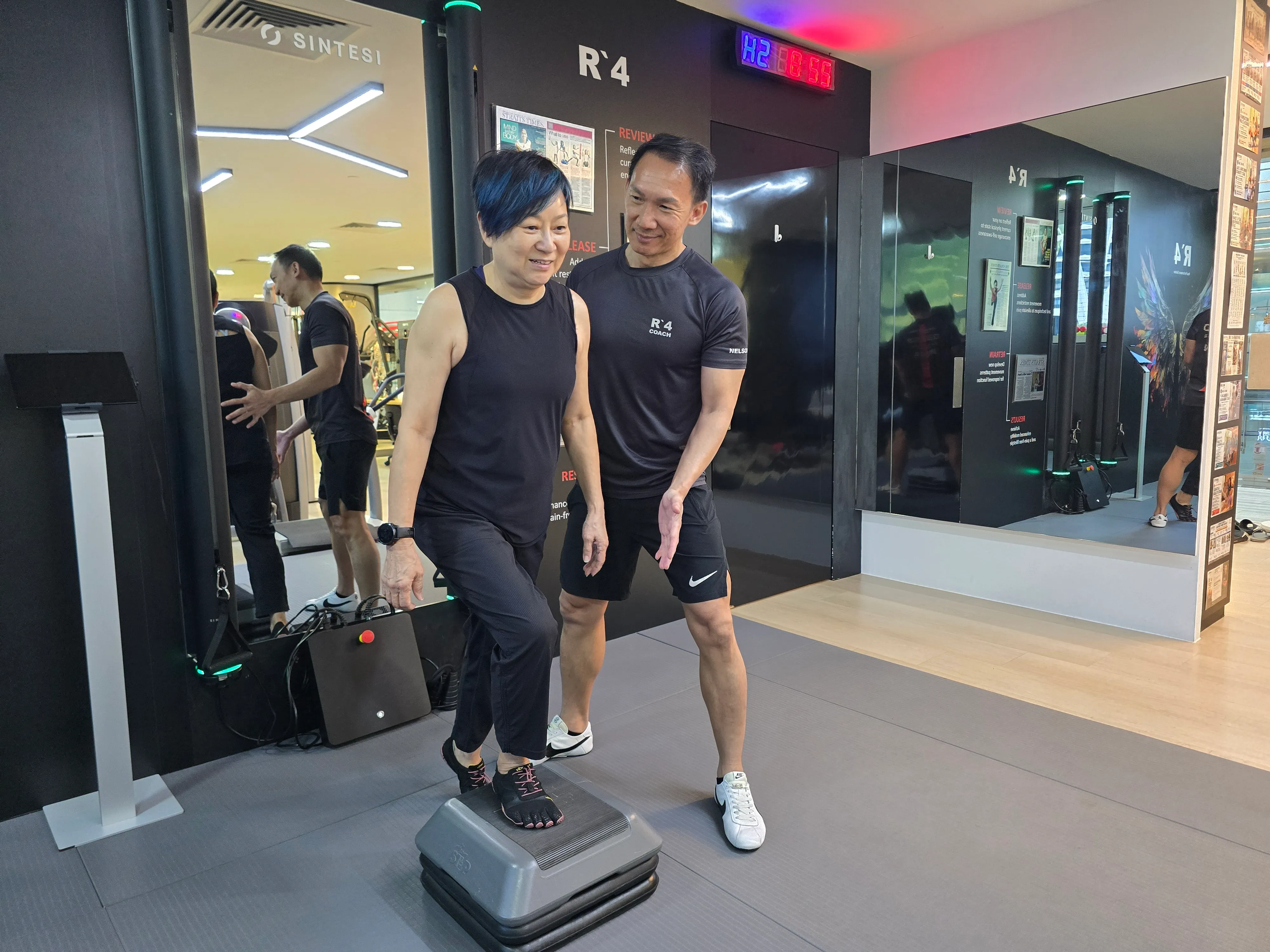 Nelson Chong coaching Lynn during step training at FTI